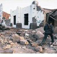 A car bomb leaves the Carmen de la Legua police station in ruins