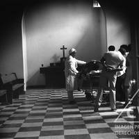 Medical personnel examine the body of Civil Guard officer Eugenio Veñazques Barra