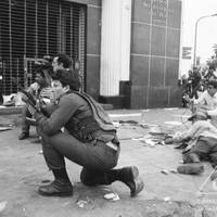 Police officers clash with Shining Path members in La Victoria, Lima