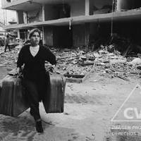 A woman who lived on Tarata Street moves her belongings to a safer place