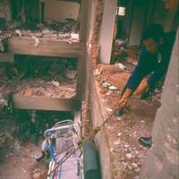 Miraflores residents retrieve their belongings after the Tarata Street bombing